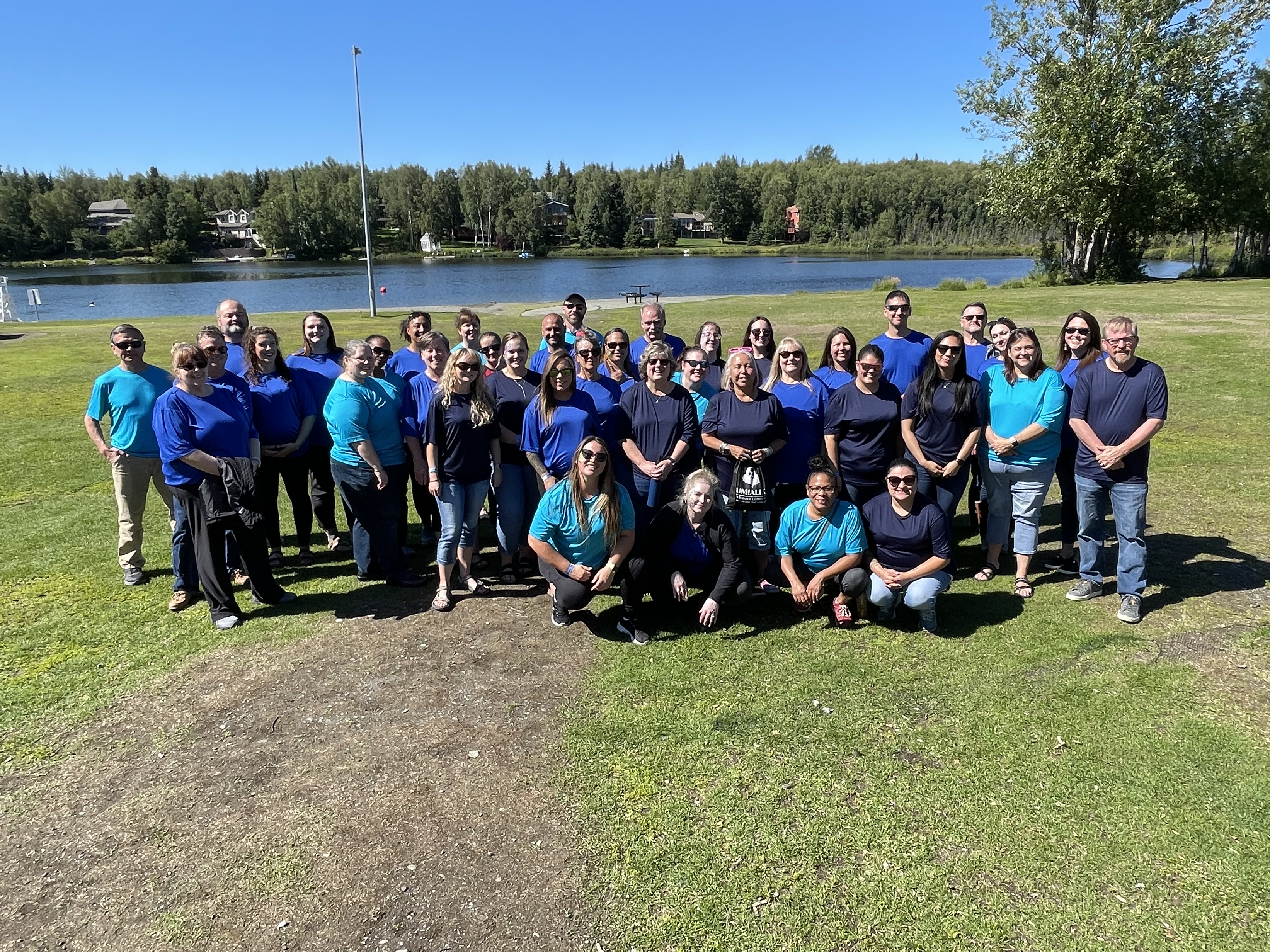 A group of Umialik employees outside at an employee celebration.