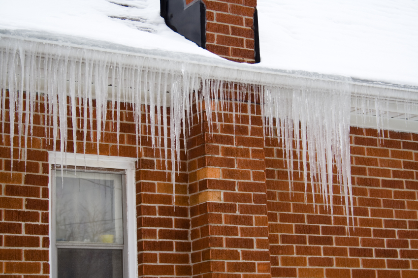 Icicles on eaves of house.